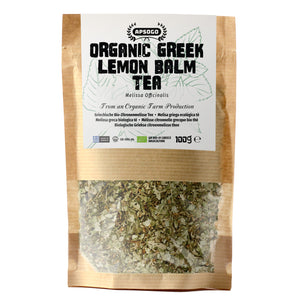 Bag of organic Greek lemon balm tea with visible herbs inside on a white background